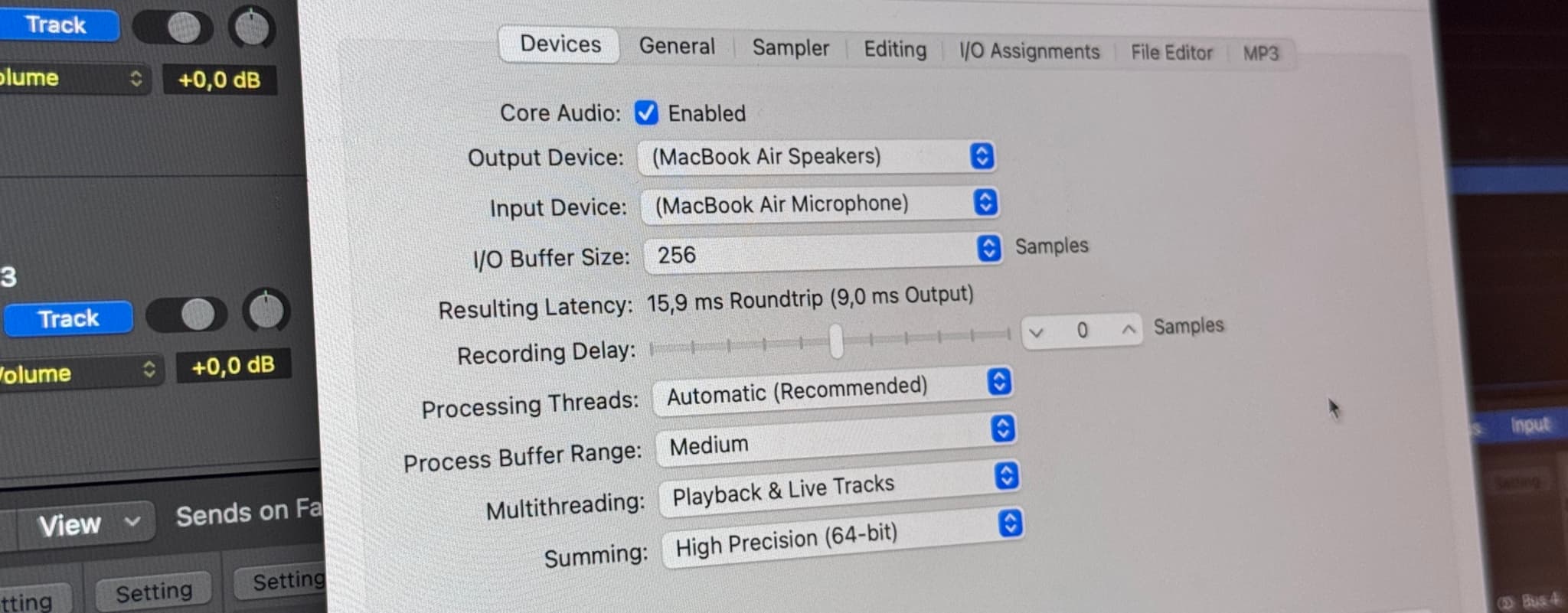 Logic Pro Buffer settings displayed on a MacBook screen.